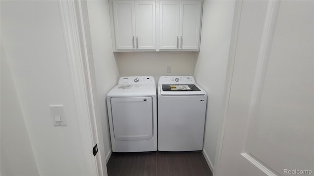 9630 Lambs Rd, Goodells, MI 48027 - laundry area featuring washing machine and dryer, cabinet space, and dark wood-style flooring
