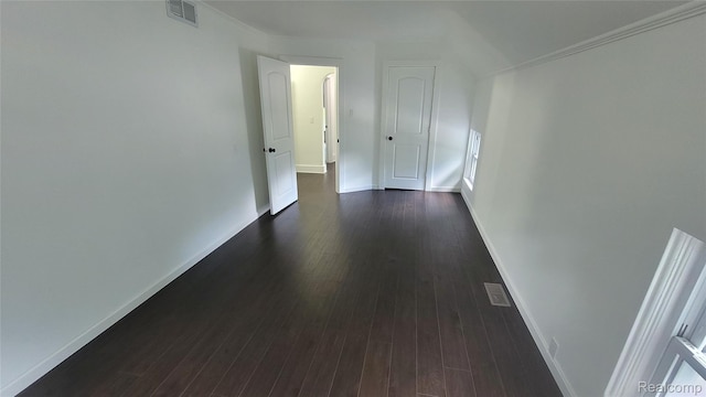 9630 Lambs Rd, Goodells, MI 48027 - hallway featuring dark wood finished floors and ornamental molding