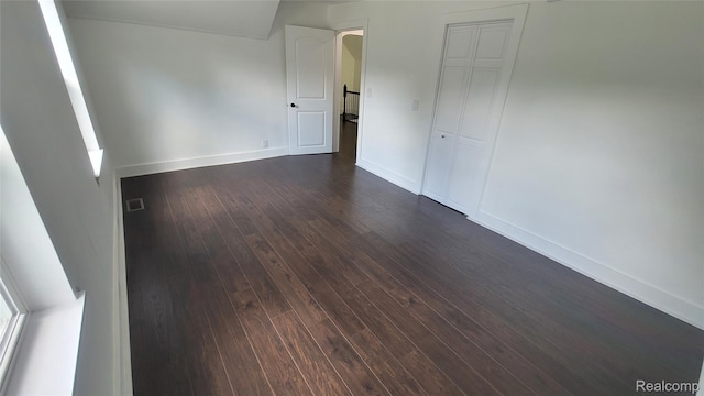 9630 Lambs Rd, Goodells, MI 48027 - unfurnished room featuring dark wood-style floors and baseboards