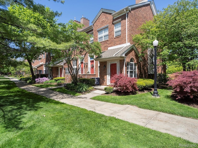 1524 Maryland Club Dr, Royal Oak, MI 48067 - view of front facade with brick siding, a chimney, and a front lawn