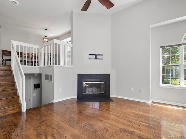 1524 Maryland Club Dr, Royal Oak, MI 48067 - unfurnished living room with wood finished floors, a chandelier, stairs, and a fireplace