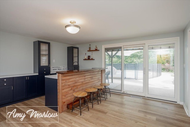 708 Magnolia Ct, Big Rapids, MI 49307 - bar area featuring light wood-style floors