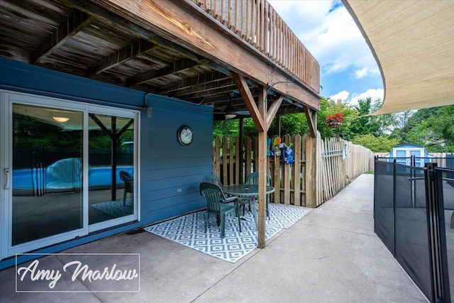708 Magnolia Ct, Big Rapids, MI 49307 - view of patio featuring a storage shed
