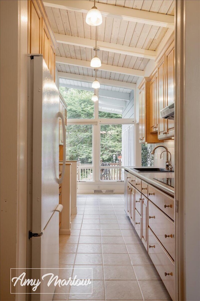 708 Magnolia Ct, Big Rapids, MI 49307 - kitchen with wood ceiling, freestanding refrigerator, light tile patterned floors, pendant lighting, and black electric stovetop