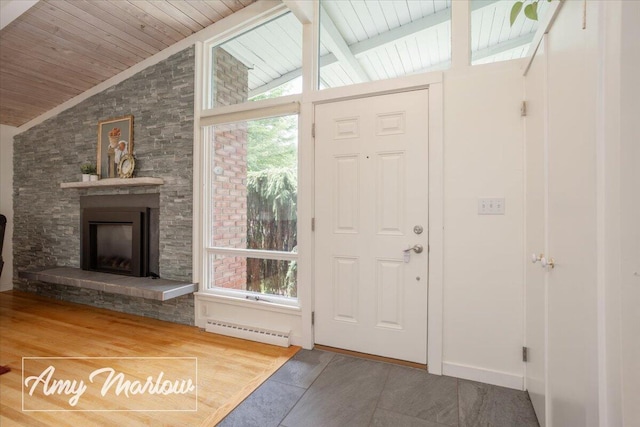 708 Magnolia Ct, Big Rapids, MI 49307 - tiled entrance foyer featuring wooden ceiling, healthy amount of natural light, and a stone fireplace