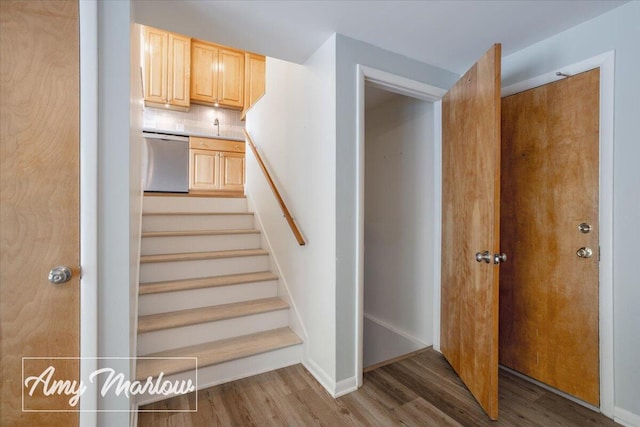 708 Magnolia Ct, Big Rapids, MI 49307 - stairway featuring wood finished floors and baseboards