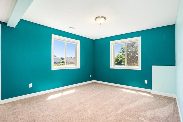 9330 Windward Dr, West Olive, MI 49460 - carpeted spare room with baseboards