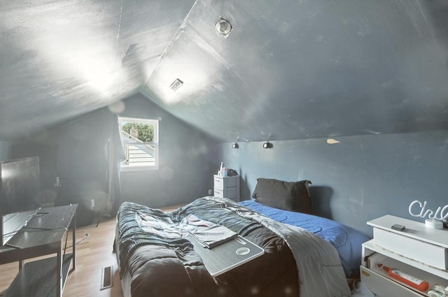 1079 Hurd Ave, Benton Harbor, MI 49022 - bedroom featuring light wood finished floors and lofted ceiling