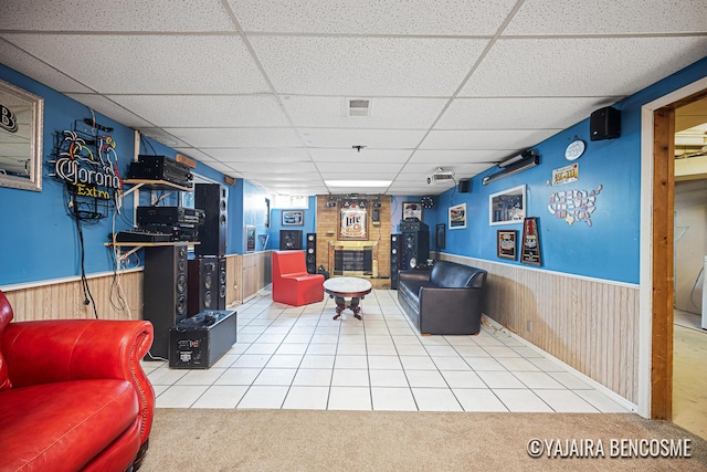 2751 Valley Ave NW, Grand Rapids, MI 49544 - living area with a drop ceiling, wainscoting, wooden walls, and carpet