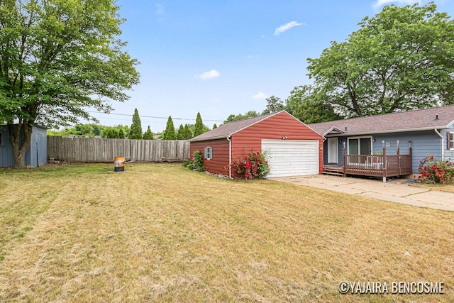 2751 Valley Ave NW, Grand Rapids, MI 49544 - view of yard featuring a garage, a deck, and a storage shed