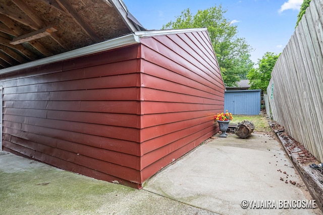 2751 Valley Ave NW, Grand Rapids, MI 49544 - view of home's exterior featuring a storage unit and a patio area