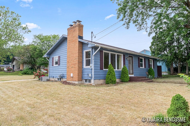 2751 Valley Ave NW, Grand Rapids, MI 49544 - view of front of home with a chimney and a front yard