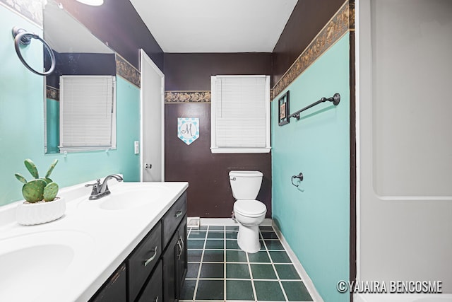 2751 Valley Ave NW, Grand Rapids, MI 49544 - full bath with double vanity and tile patterned floors