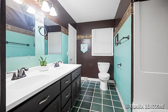 2751 Valley Ave NW, Grand Rapids, MI 49544 - bathroom with double vanity and tile patterned flooring
