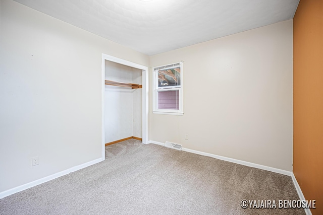 2751 Valley Ave NW, Grand Rapids, MI 49544 - unfurnished bedroom featuring carpet and a closet