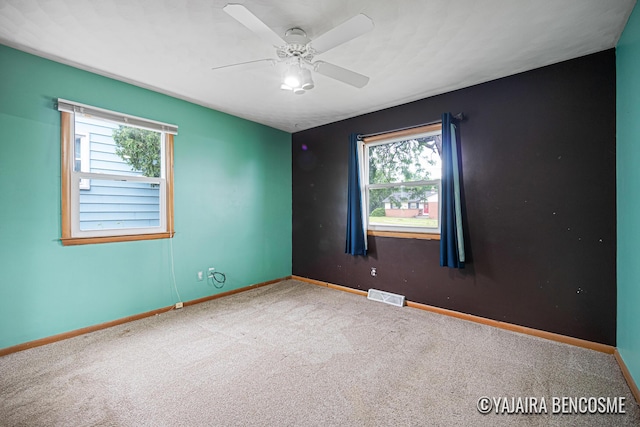 2751 Valley Ave NW, Grand Rapids, MI 49544 - unfurnished room featuring carpet, healthy amount of natural light, and ceiling fan