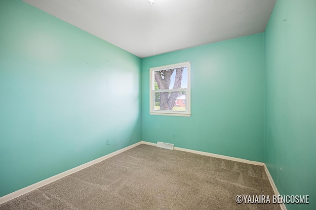 2751 Valley Ave NW, Grand Rapids, MI 49544 - unfurnished room with carpet floors and baseboards