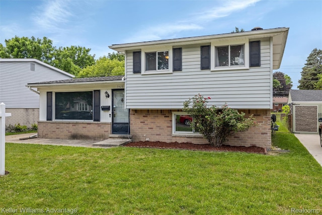9428 Oak St, Taylor, MI 48180 - tri-level home featuring brick siding and a front lawn