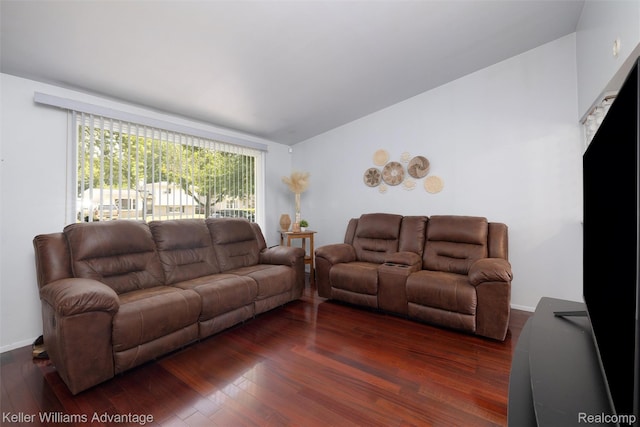 9428 Oak St, Taylor, MI 48180 - living area featuring dark wood-style floors and lofted ceiling