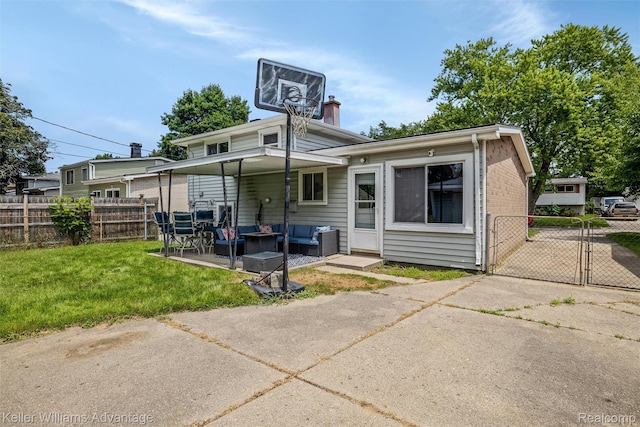 9428 Oak St, Taylor, MI 48180 - back of house featuring an outdoor hangout area, a gate, and a patio area