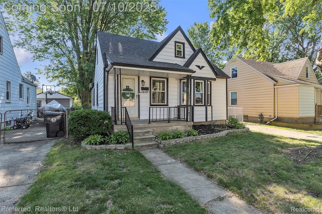 9624 Columbia, Redford, MI 48239 - bungalow with a porch, a front lawn, roof with shingles, and a gate