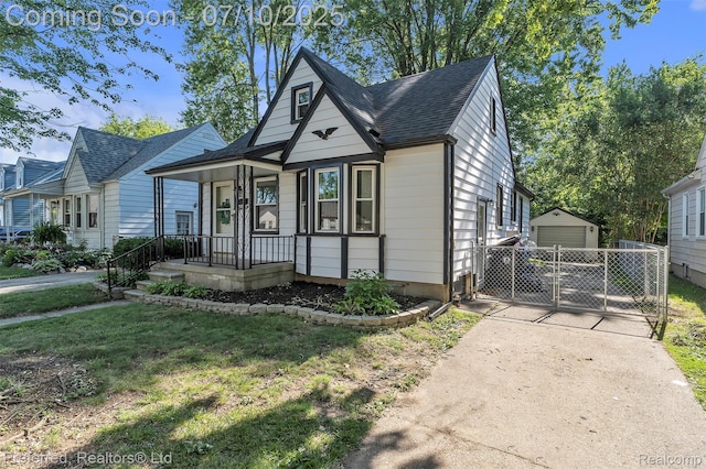 9624 Columbia, Redford, MI 48239 - view of front of property with driveway, a detached garage, roof with shingles, an outdoor structure, and a front yard