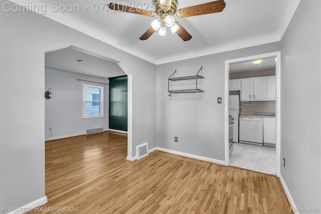 9624 Columbia, Redford, MI 48239 - spare room featuring ceiling fan, light wood-style floors, and arched walkways