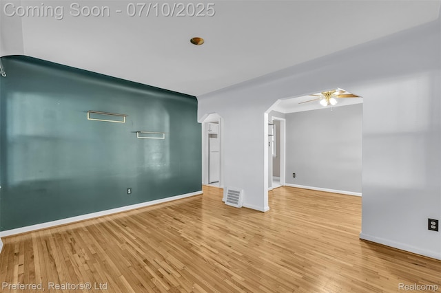 9624 Columbia, Redford, MI 48239 - unfurnished room featuring ceiling fan, wood finished floors, and arched walkways