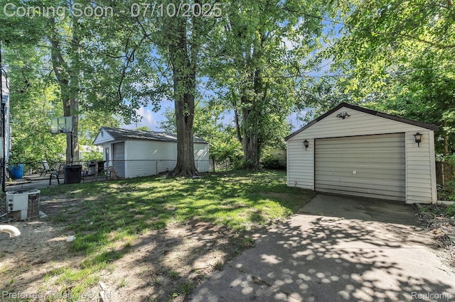 9624 Columbia, Redford, MI 48239 - view of yard featuring concrete driveway, a garage, and an outbuilding