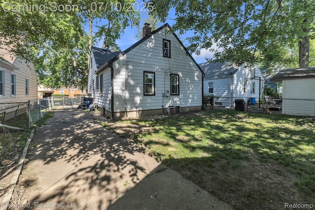 9624 Columbia, Redford, MI 48239 - back of house with a chimney and a fenced backyard