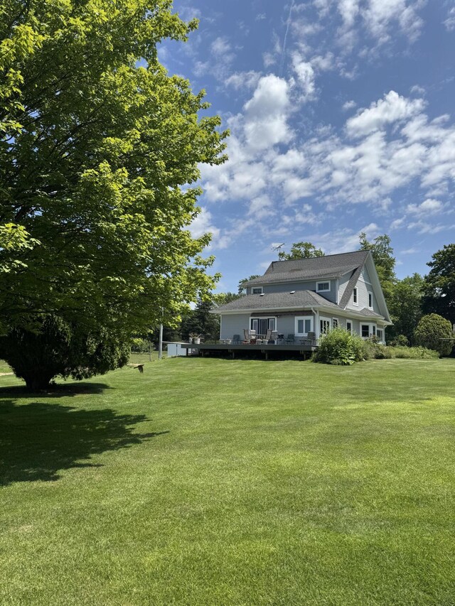 3338 Abbey Rd, Hart, MI 49420 - view of green lawn featuring a deck