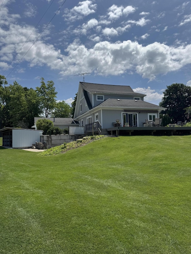 3338 Abbey Rd, Hart, MI 49420 - rear view of property with a deck and a yard