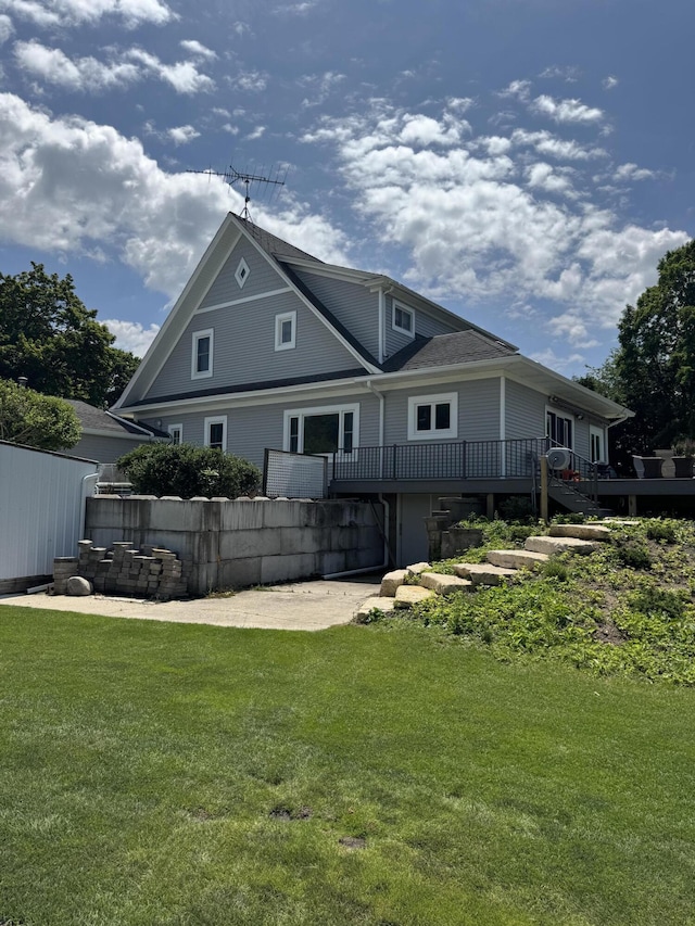 3338 Abbey Rd, Hart, MI 49420 - back of house featuring a deck and a lawn