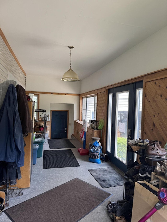 3338 Abbey Rd, Hart, MI 49420 - foyer with carpet floors, healthy amount of natural light, wood walls, and lofted ceiling