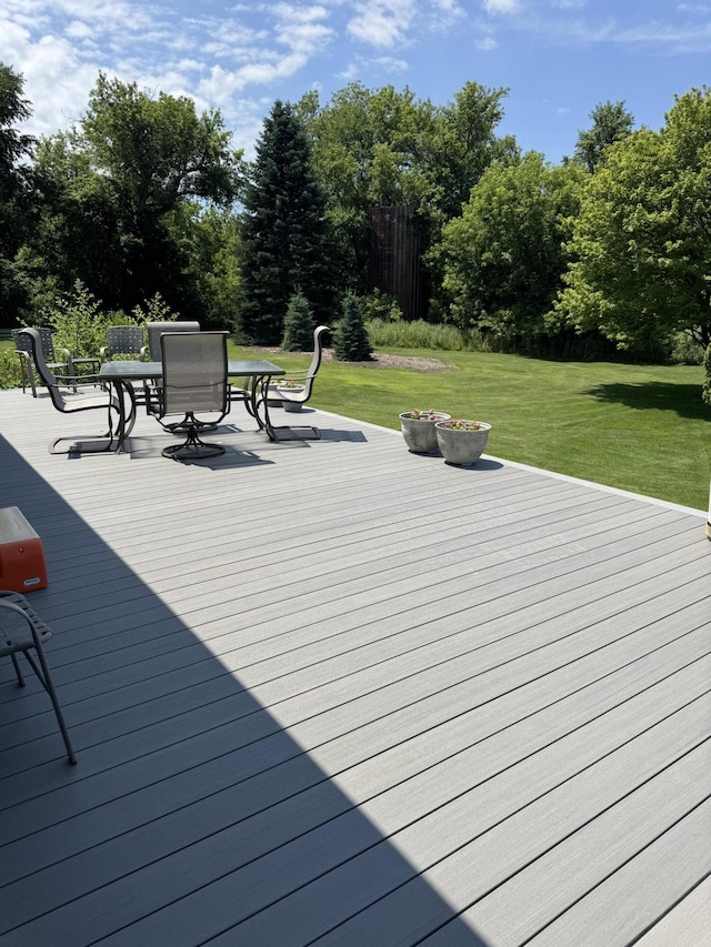 3338 Abbey Rd, Hart, MI 49420 - wooden terrace featuring a lawn and outdoor dining area