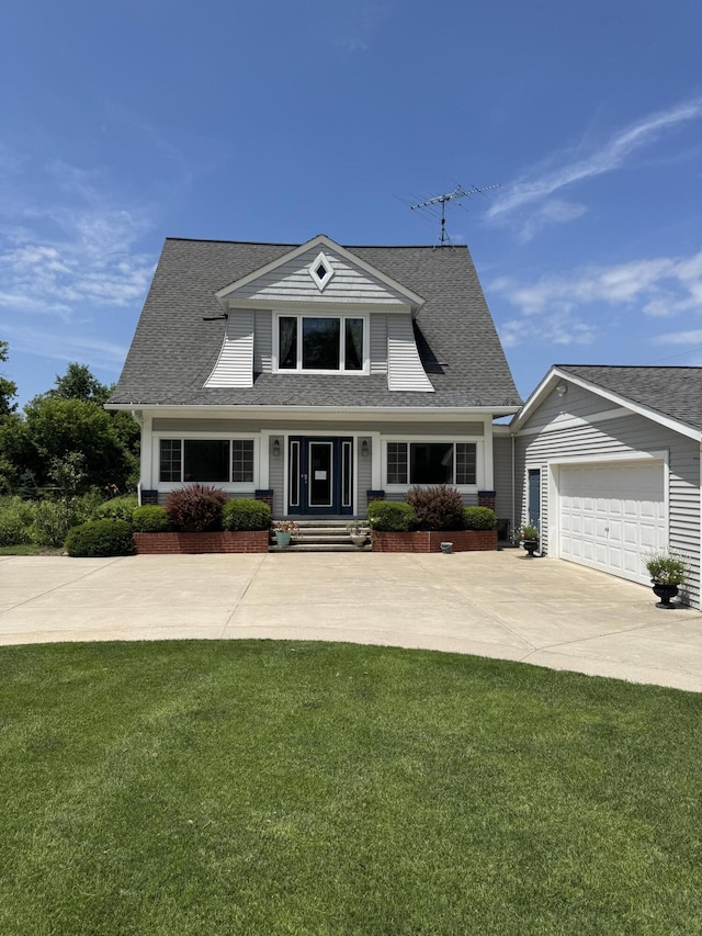 3338 Abbey Rd, Hart, MI 49420 - view of front of house featuring a front lawn, driveway, and a shingled roof