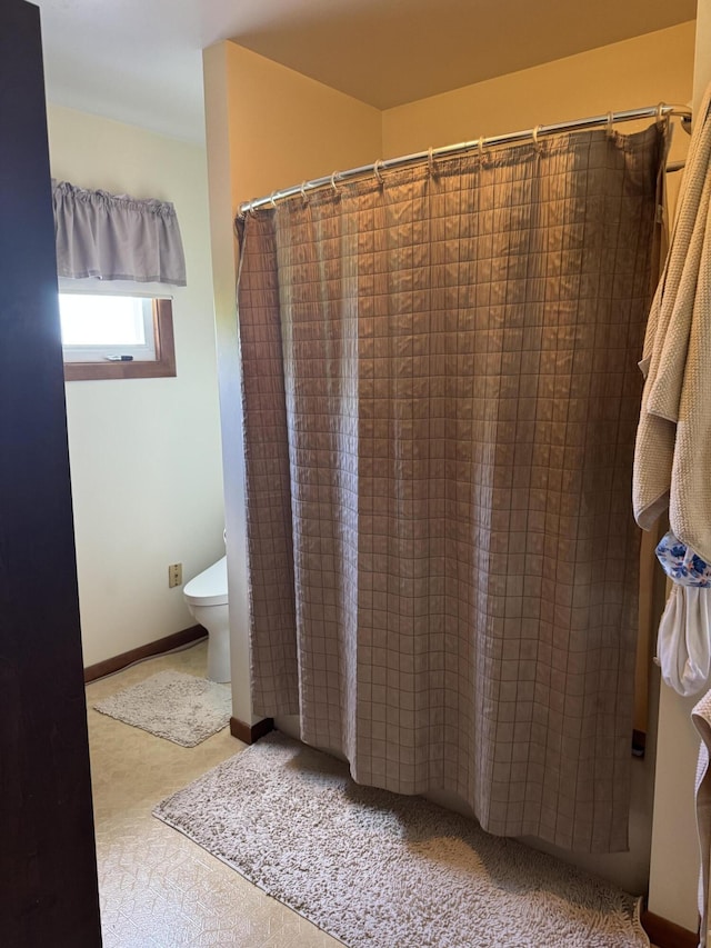 3338 Abbey Rd, Hart, MI 49420 - bathroom featuring toilet and a shower with shower curtain