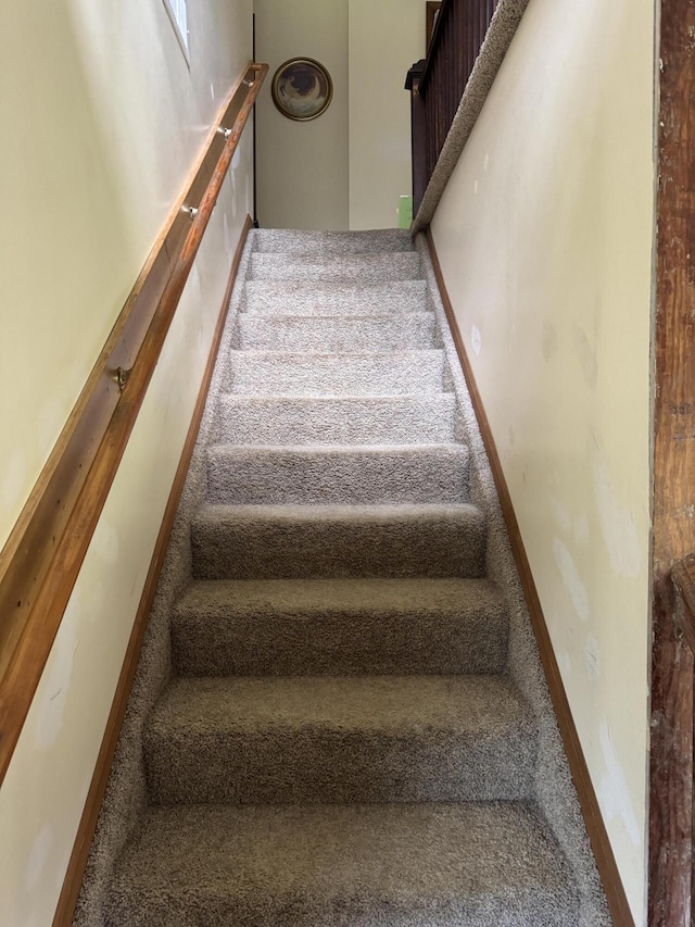3338 Abbey Rd, Hart, MI 49420 - staircase featuring carpet flooring
