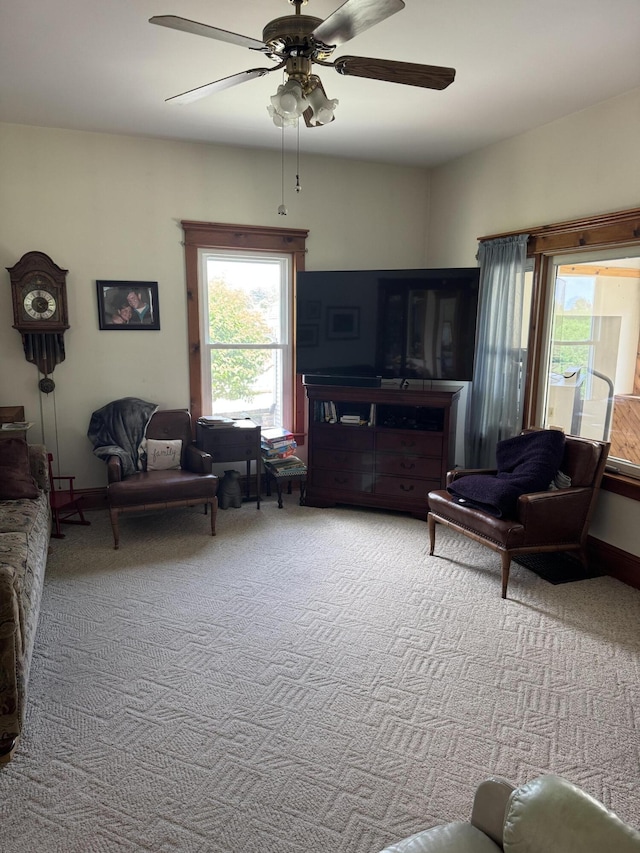 3338 Abbey Rd, Hart, MI 49420 - carpeted living room with ceiling fan and plenty of natural light