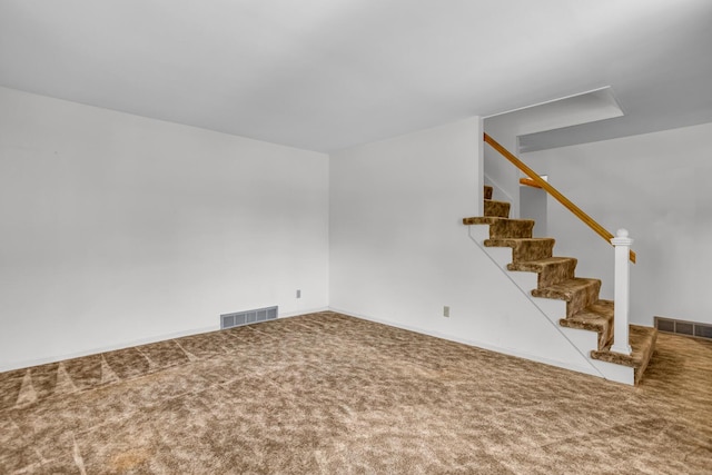 1007 Oak Grove Rd, Jackson, MI 49203 - carpeted empty room featuring stairs and baseboards