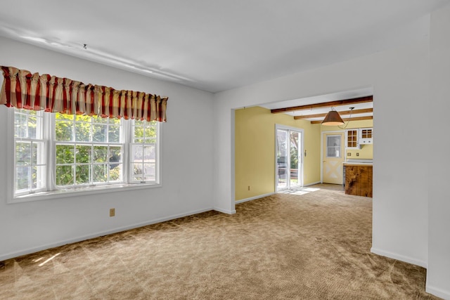 1007 Oak Grove Rd, Jackson, MI 49203 - empty room featuring carpet flooring and beamed ceiling