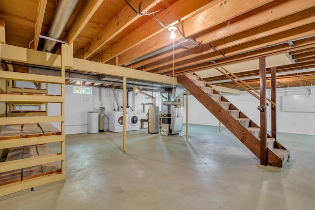 1007 Oak Grove Rd, Jackson, MI 49203 - basement with washer and dryer, water heater, stairs, a water softener, and heating unit