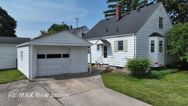508 Malzahn St, Saginaw, MI 48602 - view of front of home with entry steps, a chimney, an outdoor structure, driveway, and a detached garage