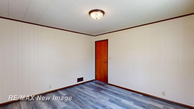 508 Malzahn St, Saginaw, MI 48602 - unfurnished room featuring wood finished floors and ornamental molding