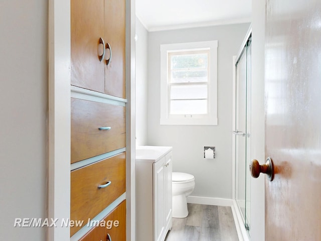 508 Malzahn St, Saginaw, MI 48602 - full bathroom with vanity, an enclosed shower, and wood finished floors