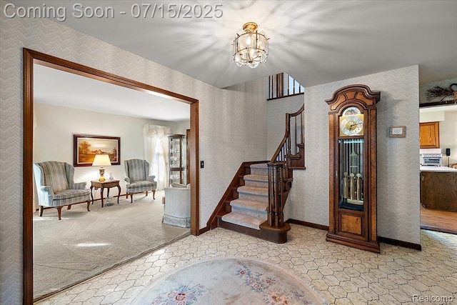 4516 Cahill Dr, Troy, MI 48098 - carpeted entryway with a chandelier, stairway, and wallpapered walls