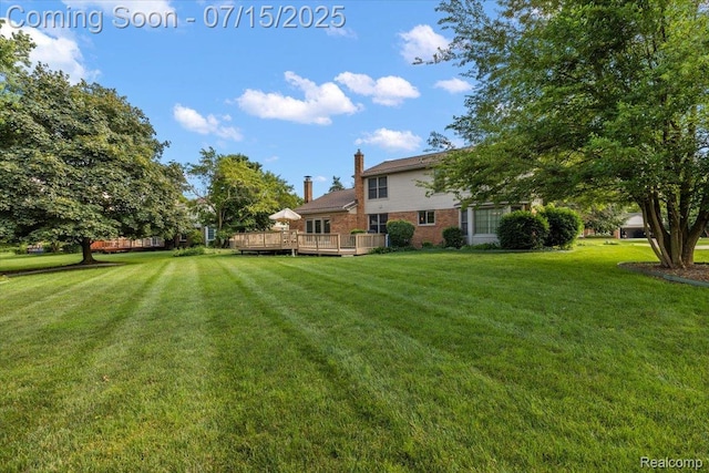 4516 Cahill Dr, Troy, MI 48098 - view of green lawn featuring a wooden deck