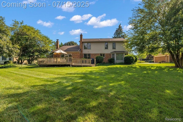 4516 Cahill Dr, Troy, MI 48098 - rear view of house with brick siding, a yard, a deck, and a chimney