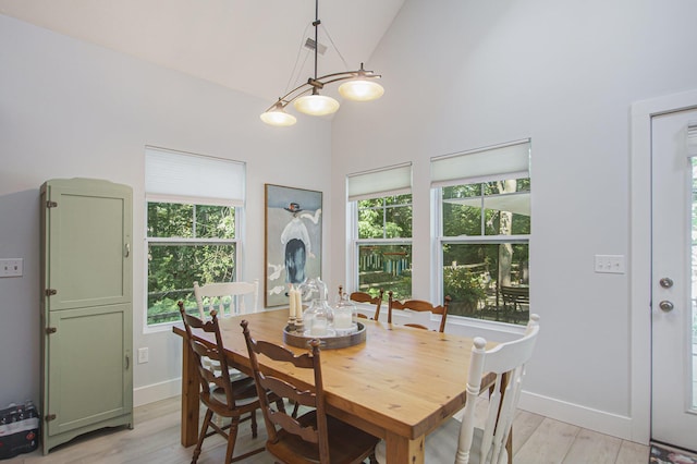 488 Solace Way S, Haven, MI 49090 - dining area featuring light wood-style flooring and high vaulted ceiling