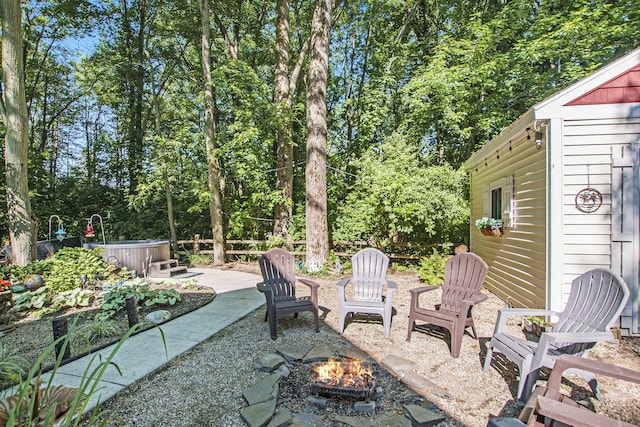 488 Solace Way S, Haven, MI 49090 - view of patio with a fire pit, a hot tub, and an outdoor structure